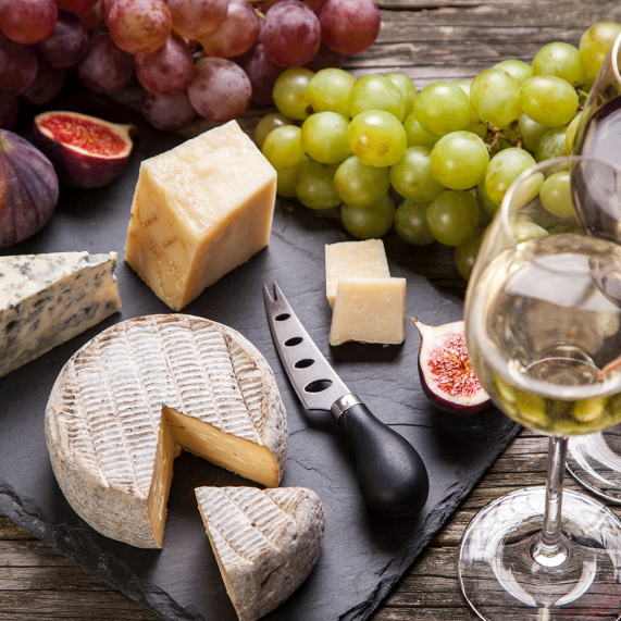 Cheese and wine platter with grapes